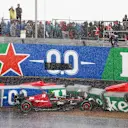 ZANDVOORT, NETHERLANDS - AUGUST 27: Zhou Guanyu of China driving the (24) Alfa Romeo F1 C43 Ferrari crashes leading to a red flag delay during the F1 Grand Prix of The Netherlands at Circuit Zandvoort on August 27, 2023 in Zandvoort, Netherlands. (Photo by Bryn Lennon - Formula 1/Formula 1 via Getty Images)