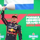 ZANDVOORT, NETHERLANDS - AUGUST 27: Race winner Max Verstappen of the Netherlands and Oracle Red Bull Racing celebrates on the podium during the F1 Grand Prix of The Netherlands at Circuit Zandvoort on August 27, 2023 in Zandvoort, Netherlands. (Photo by Peter Fox/Getty Images)