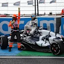 ZANDVOORT, NETHERLANDS - AUGUST 25: Daniel Ricciardo of Australia and Scuderia AlphaTauri walks from his car after crashing during practice ahead of the F1 Grand Prix of The Netherlands at Circuit Zandvoort on August 25, 2023 in Zandvoort, Netherlands. (Photo by Lars Baron/Getty Images)