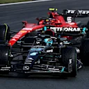 ZANDVOORT, NETHERLANDS - AUGUST 26: George Russell of Great Britain driving the (63) Mercedes AMG Petronas F1 Team W14 leads Carlos Sainz of Spain driving (55) the Ferrari SF-23 on track during qualifying ahead of the F1 Grand Prix of The Netherlands at Circuit Zandvoort on August 26, 2023 in Zandvoort, Netherlands. (Photo by Lars Baron/Getty Images)