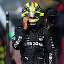 ZANDVOORT, NETHERLANDS - AUGUST 26: 13th placed qualifier Lewis Hamilton of Great Britain and Mercedes walks in the Pitlane during qualifying ahead of the F1 Grand Prix of The Netherlands at Circuit Zandvoort on August 26, 2023 in Zandvoort, Netherlands. (Photo by Dan Istitene - Formula 1/Formula 1 via Getty Images)