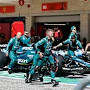 AUSTIN, TEXAS - OCTOBER 22: Aston Martin mechanics push Lance Stroll of Canada and Aston Martin F1 Team in the Pitlane prior to the F1 Grand Prix of United States at Circuit of The Americas on October 22, 2023 in Austin, Texas. (Photo by Chris Graythen/Getty Images)