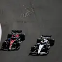AUSTIN, TEXAS - OCTOBER 22: Zhou Guanyu of China driving the (24) Alfa Romeo F1 C43 Ferrari and Yuki Tsunoda of Japan driving the (22) Scuderia AlphaTauri AT04 battle for position during the F1 Grand Prix of United States at Circuit of The Americas on October 22, 2023 in Austin, Texas. (Photo by Jared C. Tilton - Formula 1/Formula 1 via Getty Images)