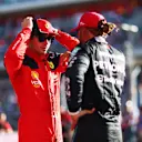 AUSTIN, TEXAS - OCTOBER 20: Pole position qualifier Charles Leclerc of Monaco and Ferrari speaks to third placed qualifier Lewis Hamilton of Great Britain and Mercedes in parc ferme after qualifying ahead of the F1 Grand Prix of United States at Circuit of The Americas on October 20, 2023 in Austin, Texas. (Photo by Dan Istitene - Formula 1/Formula 1 via Getty Images)