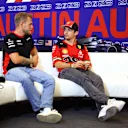 AUSTIN, TEXAS - OCTOBER 19: Kevin Magnussen of Denmark and Haas F1 and Charles Leclerc of Monaco and Ferrari talk in the Drivers Press Conference during previews ahead of the F1 Grand Prix of United States at Circuit of The Americas on October 19, 2023 in Austin, Texas. (Photo by Dan Istitene/Getty Images)