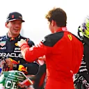 AUSTIN, TEXAS - OCTOBER 21: Sprint winner Max Verstappen of the Netherlands and Oracle Red Bull Racing and Third placed Charles Leclerc of Monaco and Ferrari talk in parc ferme during the Sprint ahead of the F1 Grand Prix of United States at Circuit of The Americas on October 21, 2023 in Austin, Texas. (Photo by Mark Thompson/Getty Images)