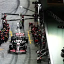SINGAPORE, SINGAPORE - SEPTEMBER 22: Kevin Magnussen of Denmark driving the (20) Haas F1 VF-24 Ferrari makes a pit stop during the F1 Grand Prix of Singapore at Marina Bay Street Circuit on September 22, 2024 in Singapore, Singapore. (Photo by Lars Baron - Formula 1/Formula 1 via Getty Images)