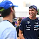 SINGAPORE, SINGAPORE - SEPTEMBER 20: Alexander Albon of Thailand and Williams talks with Daniel Ricciardo of Australia and Visa Cash App RB prior to practice ahead of the F1 Grand Prix of Singapore at Marina Bay Street Circuit on September 20, 2024 in Singapore, Singapore. (Photo by Rudy Carezzevoli/Getty Images)