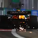 SINGAPORE, SINGAPORE - SEPTEMBER 21: Sparks fly behind Oscar Piastri of Australia driving the (81) McLaren MCL38 Mercedes during qualifying ahead of the F1 Grand Prix of Singapore at Marina Bay Street Circuit on September 21, 2024 in Singapore, Singapore. (Photo by Clive Rose - Formula 1/Formula 1 via Getty Images)