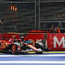 SINGAPORE, SINGAPORE - SEPTEMBER 21: Carlos Sainz of Spain and Ferrari walks from his car after crashing during qualifying ahead of the F1 Grand Prix of Singapore at Marina Bay Street Circuit on September 21, 2024 in Singapore, Singapore. (Photo by Mark Thompson/Getty Images)