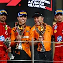 ABU DHABI, UNITED ARAB EMIRATES - DECEMBER 08: Race winner Lando Norris of Great Britain and McLaren, Second placed Carlos Sainz of Spain and Ferrari, Third placed Charles Leclerc of Monaco and Ferrari and McLaren Chief Executive Officer Zak Brown celebrate on the podium during the F1 Grand Prix of Abu Dhabi at Yas Marina Circuit on December 08, 2024 in Abu Dhabi, United Arab Emirates. (Photo by Joe Portlock/Getty Images)