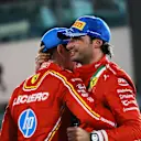 ABU DHABI, UNITED ARAB EMIRATES - DECEMBER 08: Second placed Carlos Sainz of Spain and Ferrari and Third placed Charles Leclerc of Monaco and Ferrari celebrate on the podium during the F1 Grand Prix of Abu Dhabi at Yas Marina Circuit on December 08, 2024 in Abu Dhabi, United Arab Emirates. (Photo by Bryn Lennon - Formula 1/Formula 1 via Getty Images)