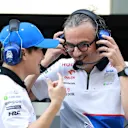 ABU DHABI, UNITED ARAB EMIRATES - DECEMBER 06: Yuki Tsunoda of Japan and Visa Cash App RB talks with Laurent Mekies, Team Principal of Visa Cash App RB on the pitwall during practice ahead of the F1 Grand Prix of Abu Dhabi at Yas Marina Circuit on December 06, 2024 in Abu Dhabi, United Arab Emirates. (Photo by Bryn Lennon - Formula 1/Formula 1 via Getty Images)