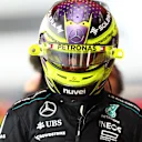ABU DHABI, UNITED ARAB EMIRATES - DECEMBER 07: 18th placed qualifier Lewis Hamilton of Great Britain and Mercedes walks in the Pitlane during qualifying ahead of the F1 Grand Prix of Abu Dhabi at Yas Marina Circuit on December 07, 2024 in Abu Dhabi, United Arab Emirates. (Photo by Bryn Lennon - Formula 1/Formula 1 via Getty Images)