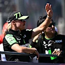 MELBOURNE, AUSTRALIA - MARCH 24: Zhou Guanyu of China and Stake F1 Team Kick Sauber and Valtteri Bottas of Finland and Stake F1 Team Kick Sauber wave to the crowd on the drivers parade prior to the F1 Grand Prix of Australia at Albert Park Circuit on March 24, 2024 in Melbourne, Australia. (Photo by Quinn Rooney - Formula 1/Formula 1 via Getty Images)