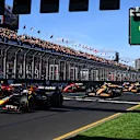 MELBOURNE, AUSTRALIA - MARCH 24: Max Verstappen of the Netherlands driving the (1) Oracle Red Bull Racing RB20 leads Carlos Sainz of Spain driving (55) the Ferrari SF-24 and the rest of the field at the start of the race during the F1 Grand Prix of Australia at Albert Park Circuit on March 24, 2024 in Melbourne, Australia. (Photo by Quinn Rooney - Formula 1/Formula 1 via Getty Images)