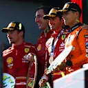 MELBOURNE, AUSTRALIA - MARCH 24: Race winner Carlos Sainz of Spain and Ferrari, Second placed Charles Leclerc of Monaco and Ferrari and Third placed Lando Norris of Great Britain and McLaren celebrate on the podium duringthe F1 Grand Prix of Australia at Albert Park Circuit on March 24, 2024 in Melbourne, Australia. (Photo by Peter Fox/Getty Images)