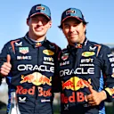 MELBOURNE, AUSTRALIA - MARCH 23: Pole position qualifier Max Verstappen of the Netherlands and Oracle Red Bull Racing and Third placed qualifier Sergio Perez of Mexico and Oracle Red Bull Racing celebrate in parc ferme during qualifying ahead of the F1 Grand Prix of Australia at Albert Park Circuit on March 23, 2024 in Melbourne, Australia. (Photo by Mark Thompson/Getty Images)