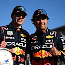 MELBOURNE, AUSTRALIA - MARCH 23: Pole position qualifier Max Verstappen of the Netherlands and Oracle Red Bull Racing and Third placed qualifier Sergio Perez of Mexico and Oracle Red Bull Racing celebrate in parc ferme during qualifying ahead of the F1 Grand Prix of Australia at Albert Park Circuit on March 23, 2024 in Melbourne, Australia. (Photo by Clive Mason - Formula 1/Formula 1 via Getty Images)