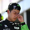 MELBOURNE, AUSTRALIA - MARCH 23: 19th placed qualifier Zhou Guanyu of China and Stake F1 Team Kick Sauber walks in the Pitlane during qualifying ahead of the F1 Grand Prix of Australia at Albert Park Circuit on March 23, 2024 in Melbourne, Australia. (Photo by Clive Mason - Formula 1/Formula 1 via Getty Images)