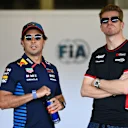 BAKU, AZERBAIJAN - SEPTEMBER 15: Sergio Perez of Mexico and Oracle Red Bull Racing and Nico Hulkenberg of Germany and Haas F1 look on from the FIA garage prior to the F1 Grand Prix of Azerbaijan at Baku City Circuit on September 15, 2024 in Baku, Azerbaijan. (Photo by Dan Mullan/Getty Images)