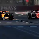 BAKU, AZERBAIJAN - SEPTEMBER 15: Oscar Piastri of Australia driving the (81) McLaren MCL38 Mercedes and Charles Leclerc of Monaco driving the (16) Ferrari SF-24 battle for the lead of the race during the F1 Grand Prix of Azerbaijan at Baku City Circuit on September 15, 2024 in Baku, Azerbaijan. (Photo by Joe Portlock - Formula 1/Formula 1 via Getty Images)