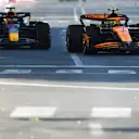 BAKU, AZERBAIJAN - SEPTEMBER 15: Lando Norris of Great Britain driving the (4) McLaren MCL38 Mercedes leads Max Verstappen of the Netherlands driving the (1) Oracle Red Bull Racing RB20 during the F1 Grand Prix of Azerbaijan at Baku City Circuit on September 15, 2024 in Baku, Azerbaijan. (Photo by Joe Portlock - Formula 1/Formula 1 via Getty Images)