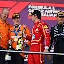 BAKU, AZERBAIJAN - SEPTEMBER 15: Race winner Oscar Piastri of Australia and McLaren, Second placed Charles Leclerc of Monaco and Ferrari, Third placed George Russell of Great Britain and Mercedes and McLaren race engineer Tom Stallard celebrate on the podium during the F1 Grand Prix of Azerbaijan at Baku City Circuit on September 15, 2024 in Baku, Azerbaijan. (Photo by James Sutton/Getty Images)