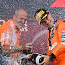 BAKU, AZERBAIJAN - SEPTEMBER 15: Race winner Oscar Piastri of Australia and McLaren and McLaren race engineer Tom Stallard celebrate on the podium during the F1 Grand Prix of Azerbaijan at Baku City Circuit on September 15, 2024 in Baku, Azerbaijan. (Photo by James Sutton/Getty Images)