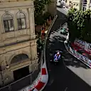 Modern speed meets 19th-century elegance as cars fly past Baku’s neoclassical façades. Swipe for more.