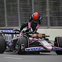 BAKU, AZERBAIJAN - SEPTEMBER 14: Esteban Ocon of France and Alpine F1 climbs from his car after stopping on track during final practice ahead of the F1 Grand Prix of Azerbaijan at Baku City Circuit on September 14, 2024 in Baku, Azerbaijan. (Photo by Dan Mullan/Getty Images)