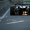 BAKU, AZERBAIJAN - SEPTEMBER 14: Sparks fly behind George Russell of Great Britain driving the (63) Mercedes AMG Petronas F1 Team W15 during qualifying ahead of the F1 Grand Prix of Azerbaijan at Baku City Circuit on September 14, 2024 in Baku, Azerbaijan. (Photo by James Sutton/Getty Images)