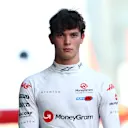 BAKU, AZERBAIJAN - SEPTEMBER 14: 11th placed qualifier Oliver Bearman of Great Britain and Haas F1 walks in the Pitlane during qualifying ahead of the F1 Grand Prix of Azerbaijan at Baku City Circuit on September 14, 2024 in Baku, Azerbaijan. (Photo by Clive Rose - Formula 1/Formula 1 via Getty Images)