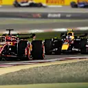 BAHRAIN, BAHRAIN - MARCH 02: Charles Leclerc of Monaco driving the (16) Ferrari SF-24 leads Sergio Perez of Mexico driving the (11) Oracle Red Bull Racing RB20 during the F1 Grand Prix of Bahrain at Bahrain International Circuit on March 02, 2024 in Bahrain, Bahrain. (Photo by Pauline Ballet - Formula 1/Formula 1 via Getty Images)