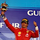 BAHRAIN, BAHRAIN - MARCH 02: Third placed Carlos Sainz of Spain and Ferrari celebrates on the podium during the F1 Grand Prix of Bahrain at Bahrain International Circuit on March 02, 2024 in Bahrain, Bahrain. (Photo by Clive Rose/Getty Images)