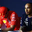 BAHRAIN, BAHRAIN - FEBRUARY 28: Carlos Sainz of Spain and Ferrari and Lewis Hamilton of Great Britain and Mercedes attend the Drivers Press Conference during previews ahead of the F1 Grand Prix of Bahrain at Bahrain International Circuit on February 28, 2024 in Bahrain, Bahrain. (Photo by Clive Rose/Getty Images)