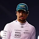 BAHRAIN, BAHRAIN - MARCH 01: 12th placed qualifier Lance Stroll of Canada and Aston Martin F1 Team walks in the Pitlane during qualifying ahead of the F1 Grand Prix of Bahrain at Bahrain International Circuit on March 01, 2024 in Bahrain, Bahrain. (Photo by Bryn Lennon - Formula 1/Formula 1 via Getty Images)