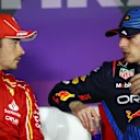 BAHRAIN, BAHRAIN - MARCH 01: Pole position qualifier Max Verstappen of the Netherlands and Oracle Red Bull Racing talks with Second placed qualifier Charles Leclerc of Monaco and Ferrari in a press conference after qualifying ahead of the F1 Grand Prix of Bahrain at Bahrain International Circuit on March 01, 2024 in Bahrain, Bahrain. (Photo by Peter Fox/Getty Images)
