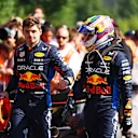 SPA, BELGIUM - JULY 28: 5th placed Max Verstappen of the Netherlands and Oracle Red Bull Racing and 8th placed Sergio Perez of Mexico and Oracle Red Bull Racing talk in parc ferme during the F1 Grand Prix of Belgium at Circuit de Spa-Francorchamps on July 28, 2024 in Spa, Belgium. (Photo by Mark Thompson/Getty Images)