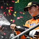SPA, BELGIUM - JULY 28: Third placed Oscar Piastri of Australia and McLaren celebrates on the podium during the F1 Grand Prix of Belgium at Circuit de Spa-Francorchamps on July 28, 2024 in Spa, Belgium. (Photo by James Sutton - Formula 1/Formula 1 via Getty Images)