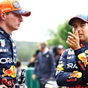 SPA, BELGIUM - JULY 27: Pole position qualifier Max Verstappen of the Netherlands and Oracle Red Bull Racing and Third placed qualifier Sergio Perez of Mexico and Oracle Red Bull Racing talk in parc ferme during qualifying ahead of the F1 Grand Prix of Belgium at Circuit de Spa-Francorchamps on July 27, 2024 in Spa, Belgium. (Photo by Mark Thompson/Getty Images)