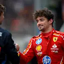 SPA, BELGIUM - JULY 27: Pole position qualifier Max Verstappen of the Netherlands and Oracle Red Bull Racing talks with Second placed qualifier Charles Leclerc of Monaco and Ferrari in parc ferme during qualifying ahead of the F1 Grand Prix of Belgium at Circuit de Spa-Francorchamps on July 27, 2024 in Spa, Belgium. (Photo by Rudy Carezzevoli/Getty Images)
