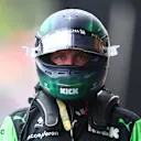 SPA, BELGIUM - JULY 27: 14th placed qualifier Valtteri Bottas of Finland and Stake F1 Team Kick Sauber walks in the Pitlane during qualifying ahead of the F1 Grand Prix of Belgium at Circuit de Spa-Francorchamps on July 27, 2024 in Spa, Belgium. (Photo by Bryn Lennon - Formula 1/Formula 1 via Getty Images)