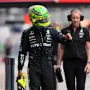 SAO PAULO, BRAZIL - NOVEMBER 01: 11th placed qualifier Lewis Hamilton of Great Britain and Mercedes walks in the Pitlane during Sprint Qualifying ahead of the F1 Grand Prix of Brazil at Autodromo Jose Carlos Pace on November 01, 2024 in Sao Paulo, Brazil. (Photo by Lars Baron - Formula 1/Formula 1 via Getty Images)