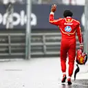 SAO PAULO, BRAZIL - NOVEMBER 03: 14th placed qualifier Carlos Sainz of Spain and Ferrari waves to fans after crashing during qualifying ahead of the F1 Grand Prix of Brazil at Autodromo Jose Carlos Pace on November 03, 2024 in Sao Paulo, Brazil. (Photo by Peter Fox - Formula 1/Formula 1 via Getty Images)