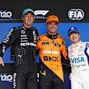 SAO PAULO, BRAZIL - NOVEMBER 03: Pole position qualifier Lando Norris of Great Britain and McLaren, Second placed qualifier George Russell of Great Britain and Mercedes and Third placed qualifier Yuki Tsunoda of Japan and Visa Cash App RB pose for a photo in parc ferme  during qualifying ahead of the F1 Grand Prix of Brazil at Autodromo Jose Carlos Pace on November 03, 2024 in Sao Paulo, Brazil. (Photo by Lars Baron - Formula 1/Formula 1 via Getty Images)