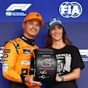 SAO PAULO, BRAZIL - NOVEMBER 03: Pole position qualifier Lando Norris of Great Britain and McLaren is presented with the Pirelli Pole Position award by Bianca Senna in parc ferme during qualifying ahead of the F1 Grand Prix of Brazil at Autodromo Jose Carlos Pace on November 03, 2024 in Sao Paulo, Brazil. (Photo by Lars Baron - Formula 1/Formula 1 via Getty Images)