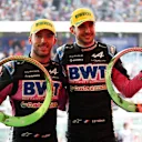 SAO PAULO, BRAZIL - NOVEMBER 03: Second placed Esteban Ocon of France and Alpine F1 and Third placed Pierre Gasly of France and Alpine F1 celebrate on the podium after the F1 Grand Prix of Brazil at Autodromo Jose Carlos Pace on November 03, 2024 in Sao Paulo, Brazil. (Photo by Lars Baron - Formula 1/Formula 1 via Getty Images)