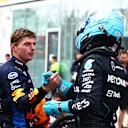 MONTREAL, QUEBEC - JUNE 08: Pole position qualifier George Russell of Great Britain and Mercedes and Second placed qualifier Max Verstappen of the Netherlands and Oracle Red Bull Racing celebrate in parc ferme during qualifying ahead of the F1 Grand Prix of Canada at Circuit Gilles Villeneuve on June 08, 2024 in Montreal, Quebec. (Photo by Mark Thompson/Getty Images)