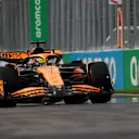MONTREAL, QUEBEC - JUNE 08: Oscar Piastri of Australia driving the (81) McLaren MCL38 Mercedes next to a groundhog on track during qualifying ahead of the F1 Grand Prix of Canada at Circuit Gilles Villeneuve on June 08, 2024 in Montreal, Quebec. (Photo by Chris Graythen/Getty Images)